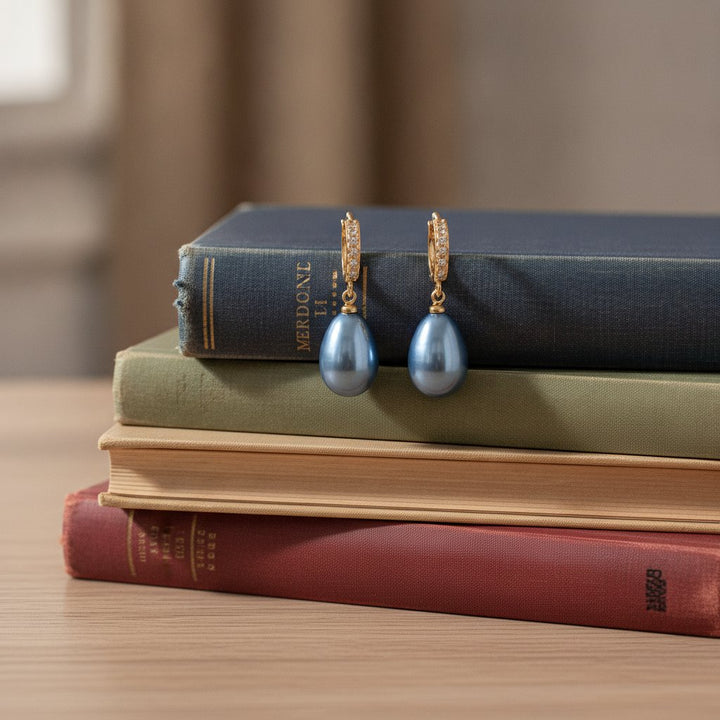 Boucles d'oreilles pendantes avec perle bleue