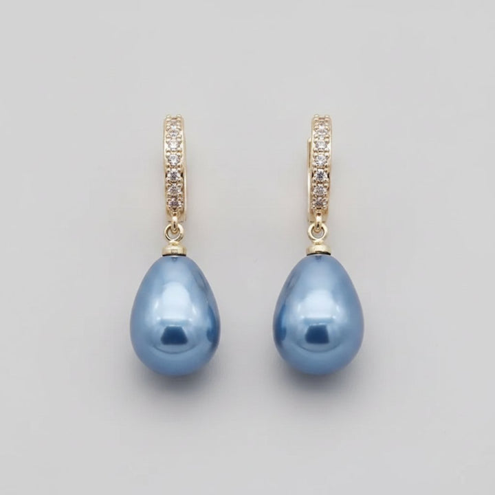 Boucles d'oreilles pendantes avec perle bleue