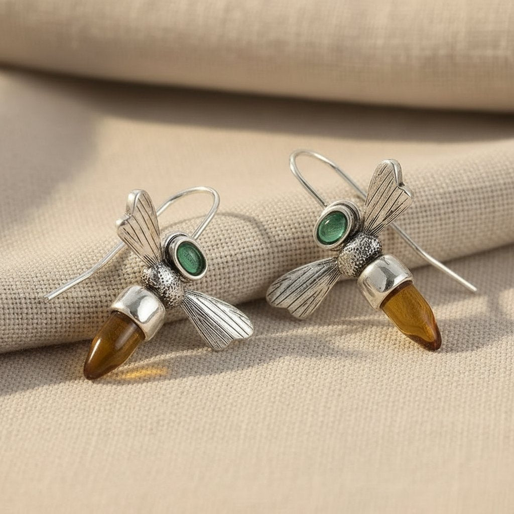 Zaļojošā čuksta bišu elegances piliens auskari