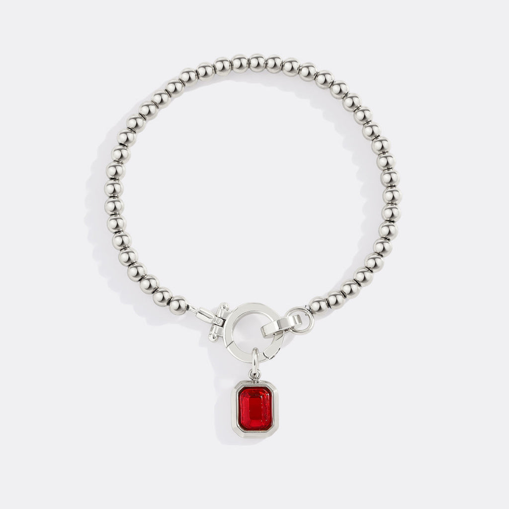 Mintkleurige kralenarmband met baguette geboortesteenbedel