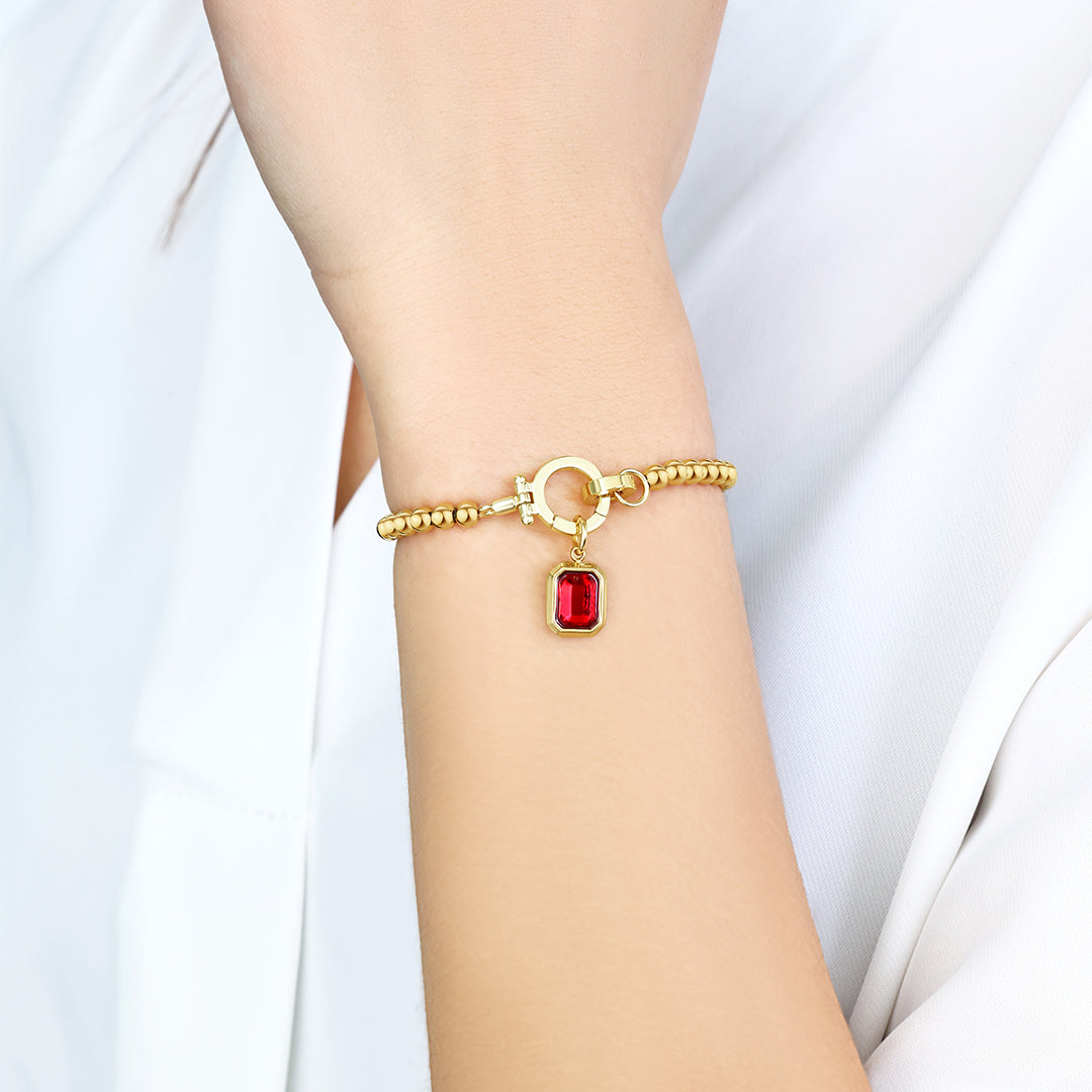 Mintkleurige kralenarmband met baguette geboortesteenbedel