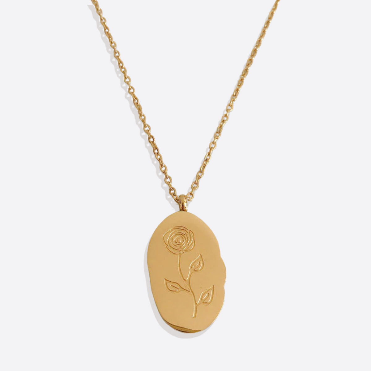 Halsband med hängsmycke i guld och födelseblomma