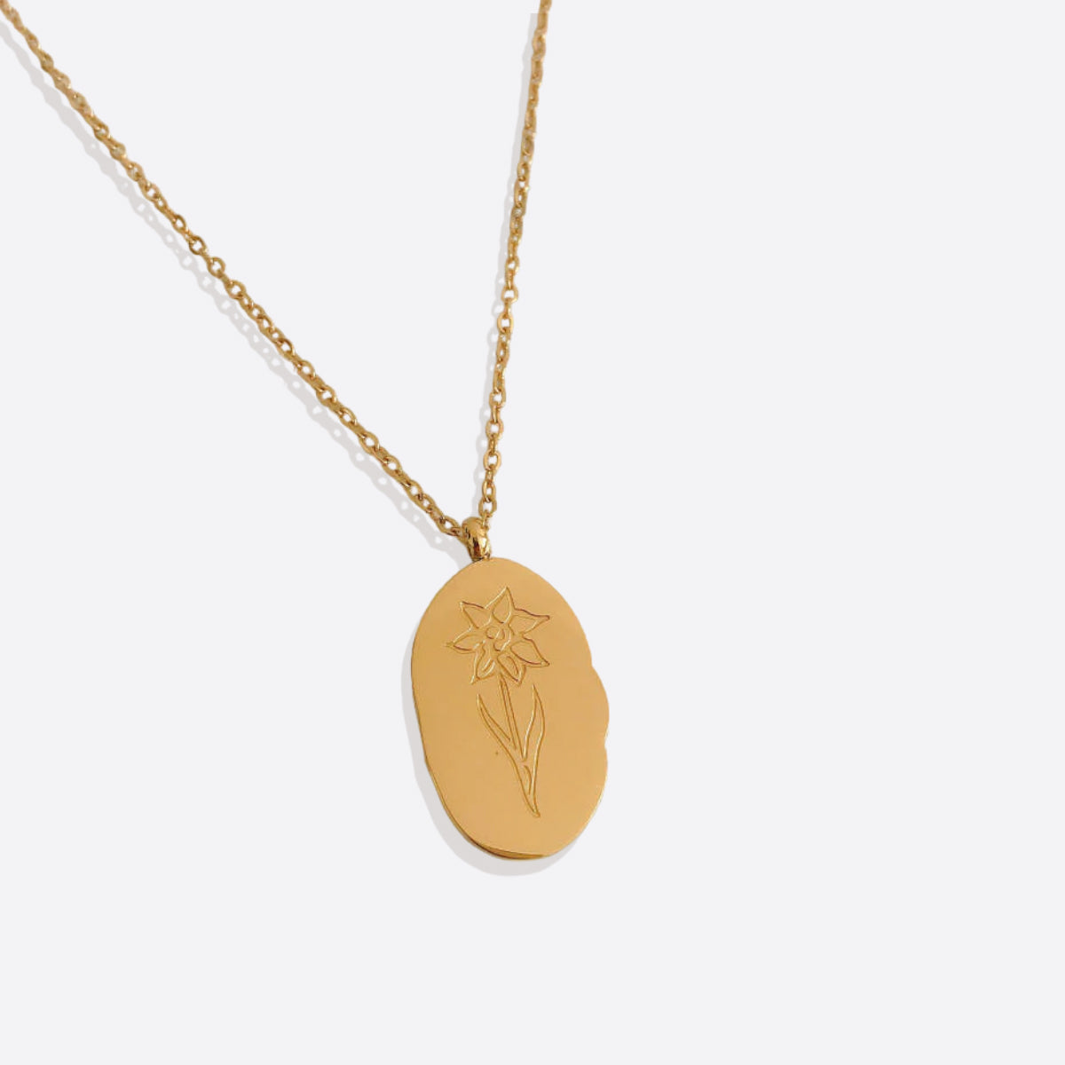Halsband med hängsmycke i guld och födelseblomma