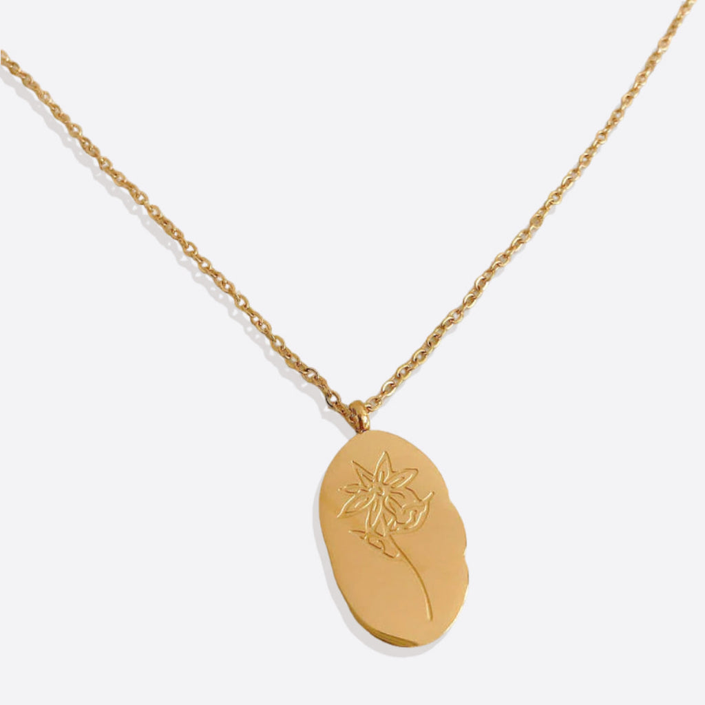 Halsband med hängsmycke i guld och födelseblomma