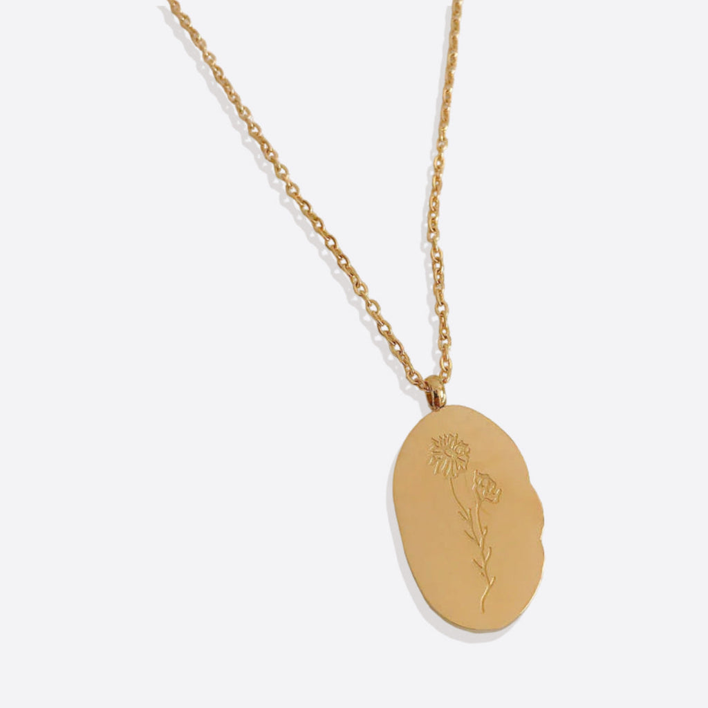 Halsband med hängsmycke i guld och födelseblomma