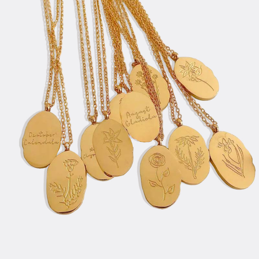 Halsband med hängsmycke i guld och födelseblomma