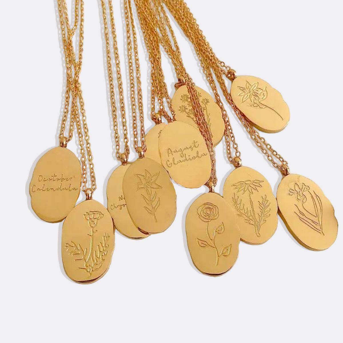 Halsband med hängsmycke i guld och födelseblomma