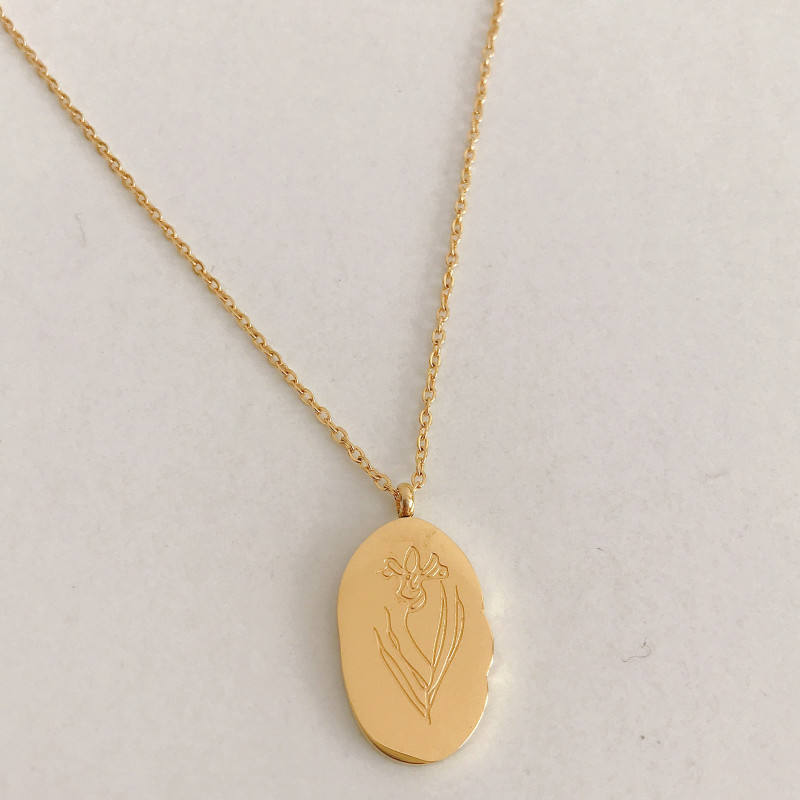 Halsband med hängsmycke i guld och födelseblomma