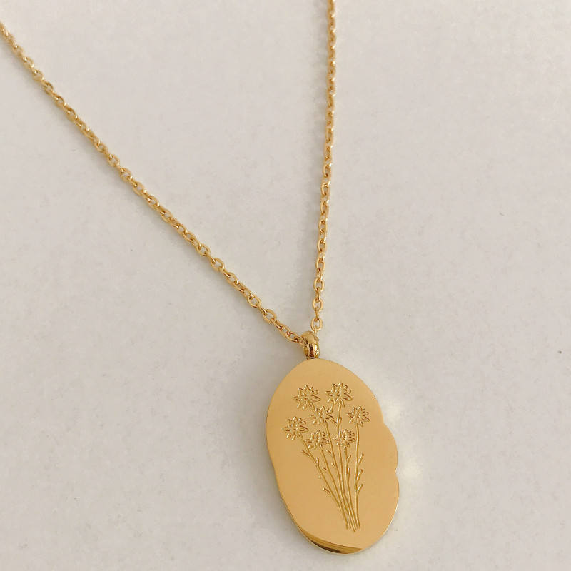 Halsband med hängsmycke i guld och födelseblomma