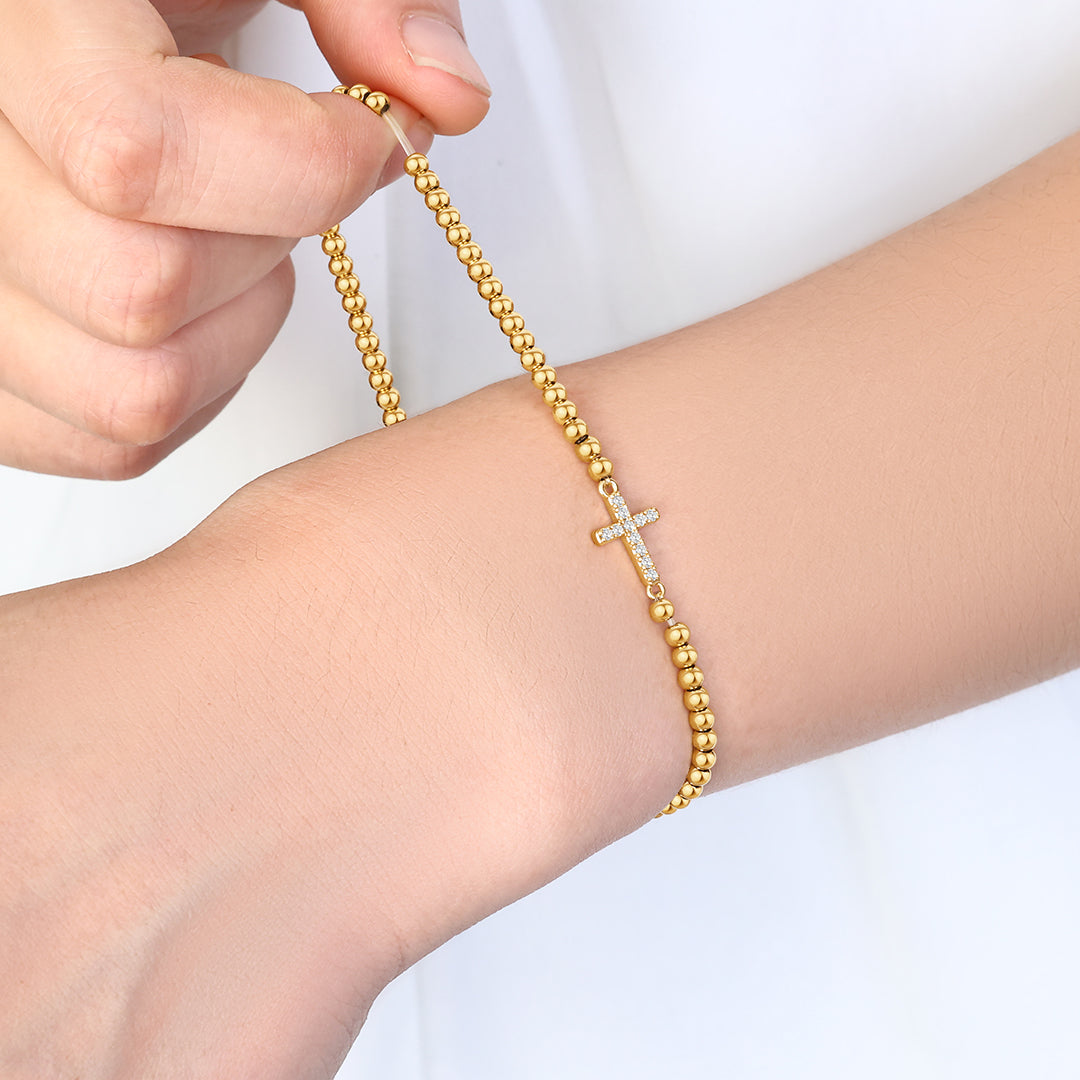 Pulseira Elástica com Cruz e Contas Douradas