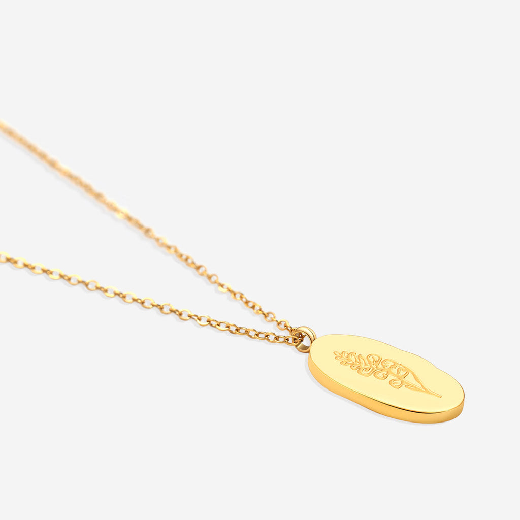 Halsband med hängsmycke i guld och födelseblomma